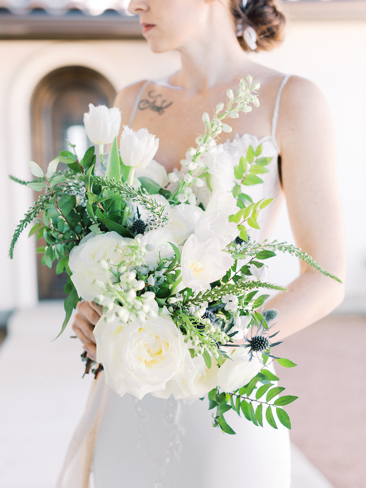 White and greenery wedding bouquet: Elopement vineyard wedding at Umbra Winery by Alexa Kay Events. See more wedding ideas at alexakayevents.com!