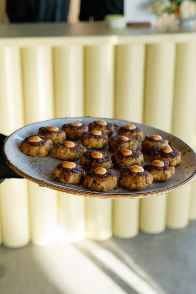 Food displayed with citrus accents at Cowboys Golf Club corporate event.