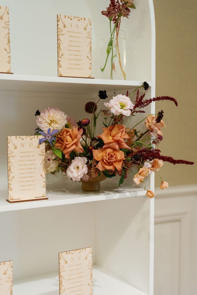 Wooden Seating Chart for Taylor & Javier's Adolphus Hotel Wedding: A warm and rustic touch, the custom wooden seating chart perfectly complemented the elegant yet personal ambiance of the day, ensuring every guest knew their place at the reception.