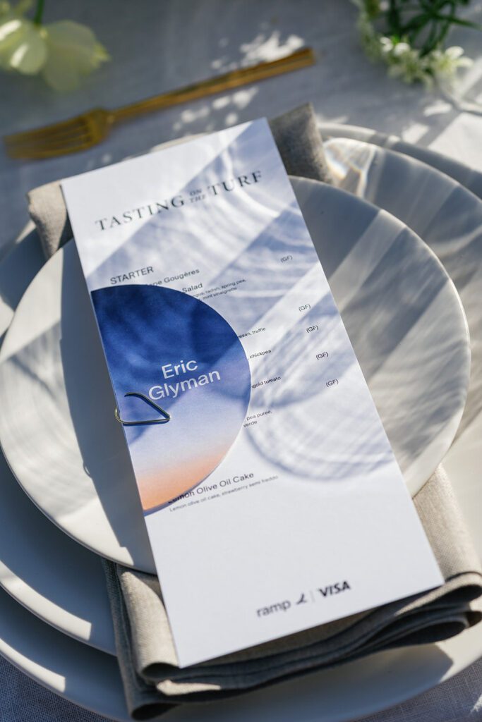 Visa × Ramp event branding displayed through signage and styled accents.