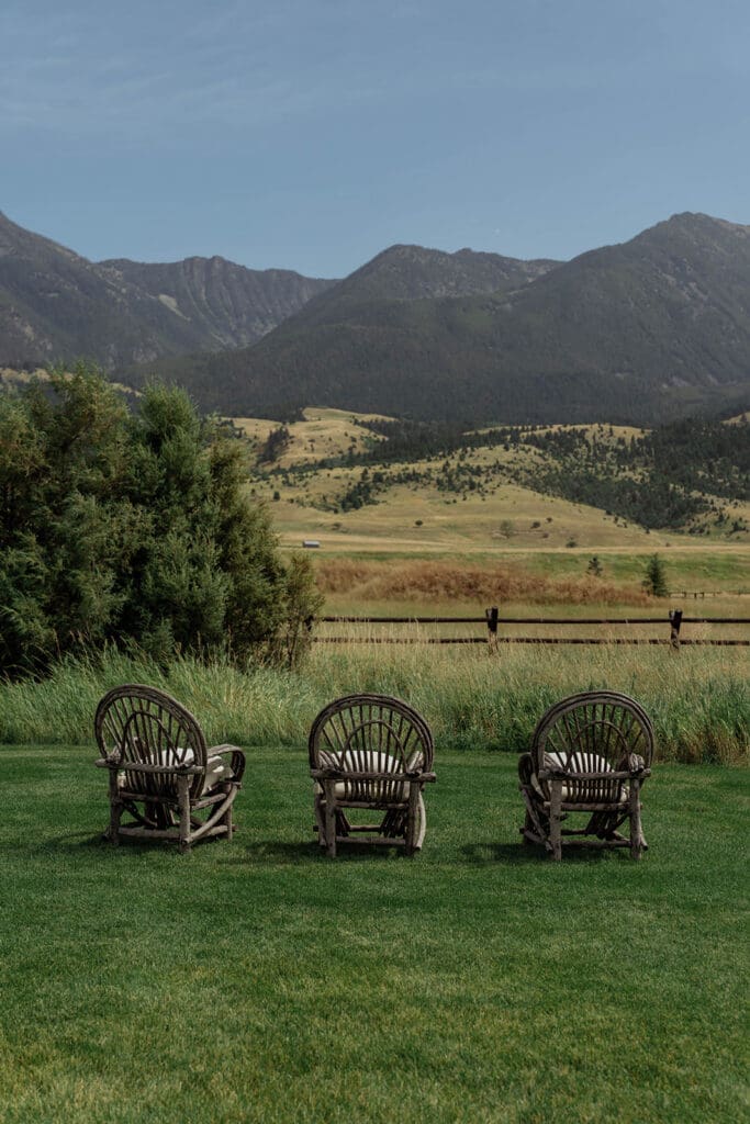 Rustic chairs overlooking the mountains at Copper Rose Ranch in Montana