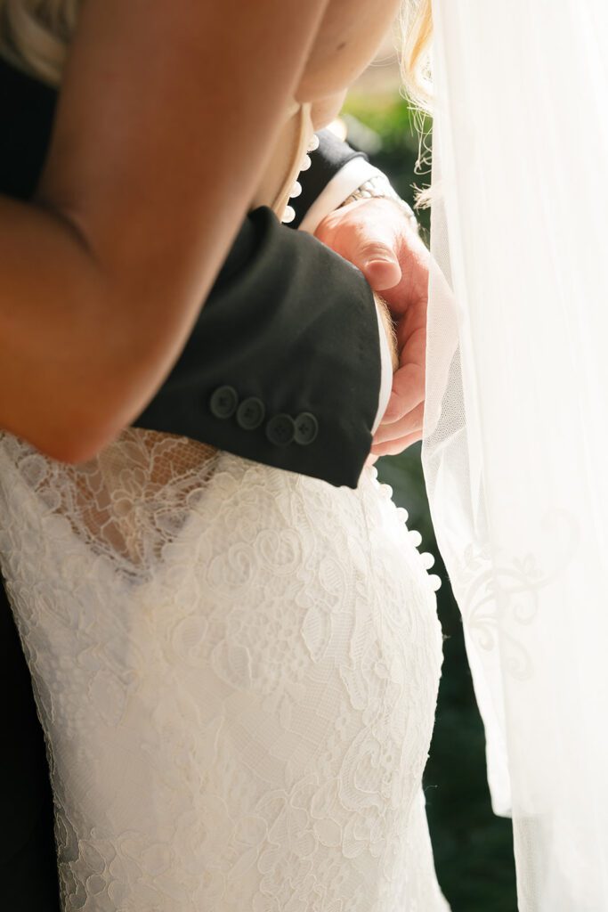 Bridal gown detail at The Drover Hotel featuring lace texture and Western-inspired design.