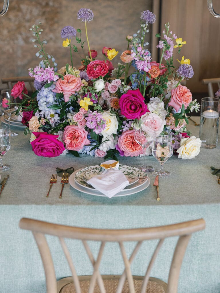 Intimate family dinner setup with lush floral design